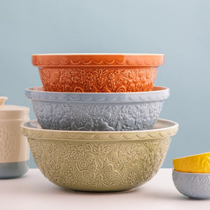 Mason Cash Home To Roost Hen Mixing Bowls, stack of embossed ceramic bowls in various colours on a light background.