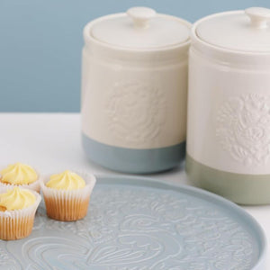 Mason Cash Home To Roost Storage Jars styled with cupcakes and the matching ceramic platter.
