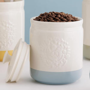 Mason Cash Home To Roost Storage Jar in Blue 15cm shown close up filled with coffee beans.