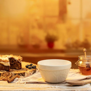 Mason Cash In the Forest Fox Pudding Basin in cream shown against a warm background with a honeypot