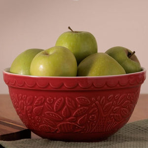 Mason Cash In The Forest Hedgehog Red Mixing Bowl with green apples on a neutral background