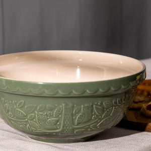 Mason Cash In The Forest Owl Mixing Bowl in Dark Green (26 cm) shown close up against a grey background.