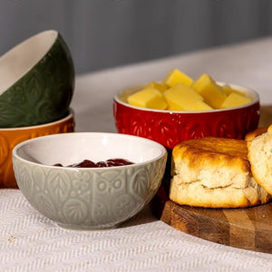 Mason Cash In The Forest Prep Bowls with biscuits, butter, and jam on a table.