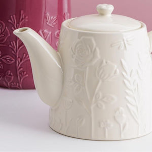 Mason Cash In The Meadow Cream Teapot on a pink and white background