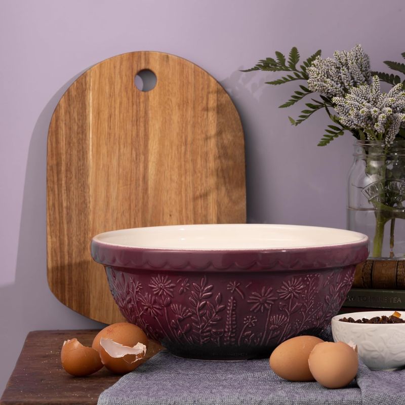 Mason Cash In the Meadow Daisy mixing bowl in purple, side view showing embossed floral design