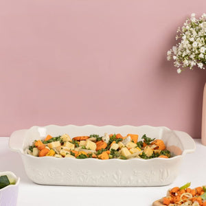 Vegetable casserole in the Mason Cash In The Meadow Large Rectangular Oven Dish on a pink background