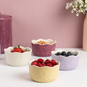Mason Cash In The Meadow Ramekins Set of 4 shown against a pink background.