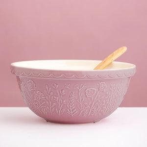 Pink Mason Cash In the Meadow mixing bowl on a bench with wooden spoon