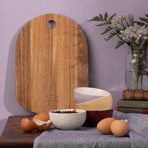 Mason Cash prep bowls on a kitchen bench with wooden board and eggs