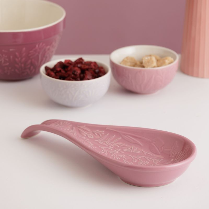 Pink Mason Cash In the Meadow Spoon Rest with embossed floral design, photographed against a white background.