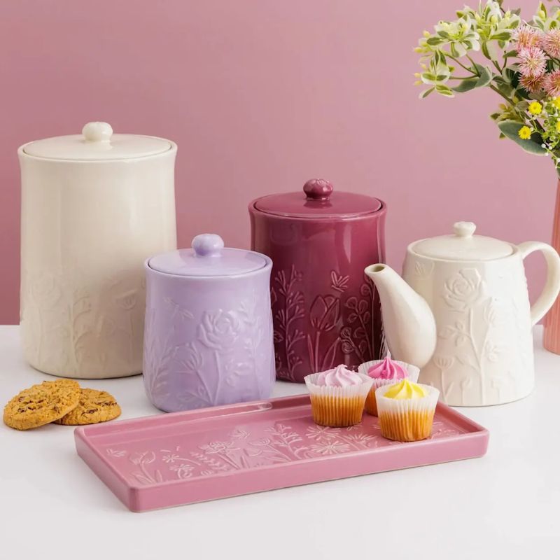 Mason Cash In The Meadow Pink Rectangle Platter styled on table with storage jars and tea pot from the collection behind.