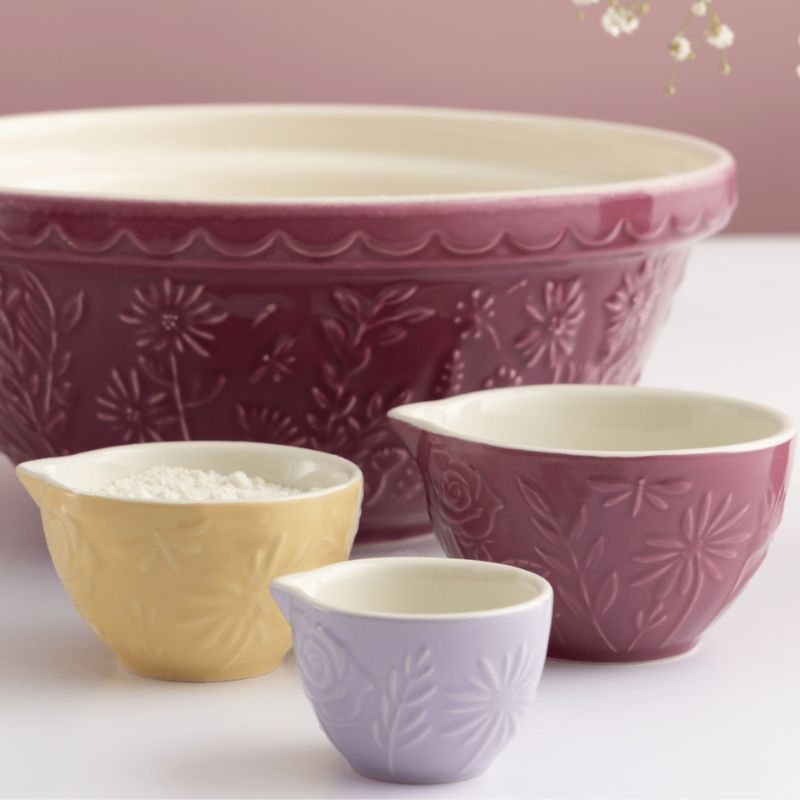 Set of 3 Mason Cash In The Meadow Measuring Cups in purples and yellow, shown on a white background.