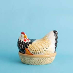 Ceramic Mason Cash Mother Hen Nest against a blue background