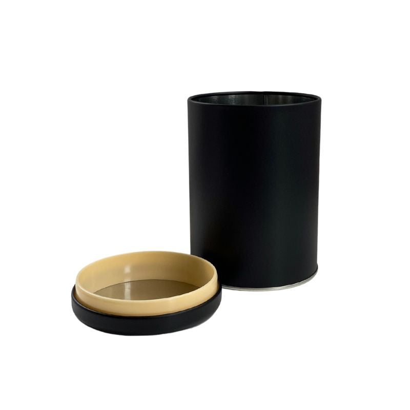 Matte black canister with a plug lid shown on a white background.