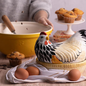 Mason Cash Mother Hen Nest styled with eggs and baking tools on a kitchen bench