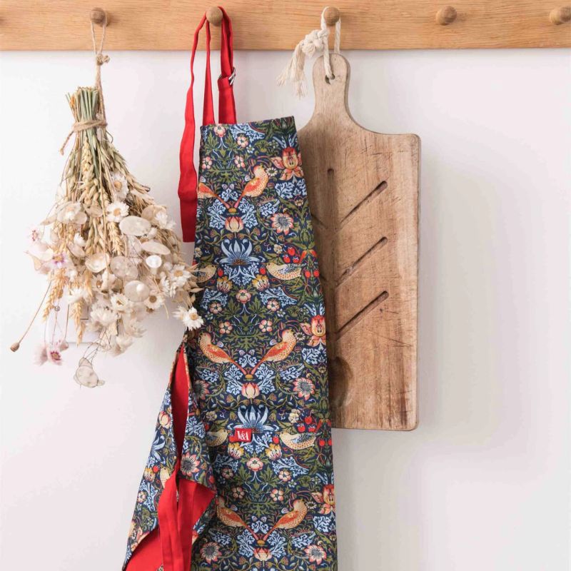 Museums & Galleries Strawberry Thief Apron with bird and floral print, on a white background.