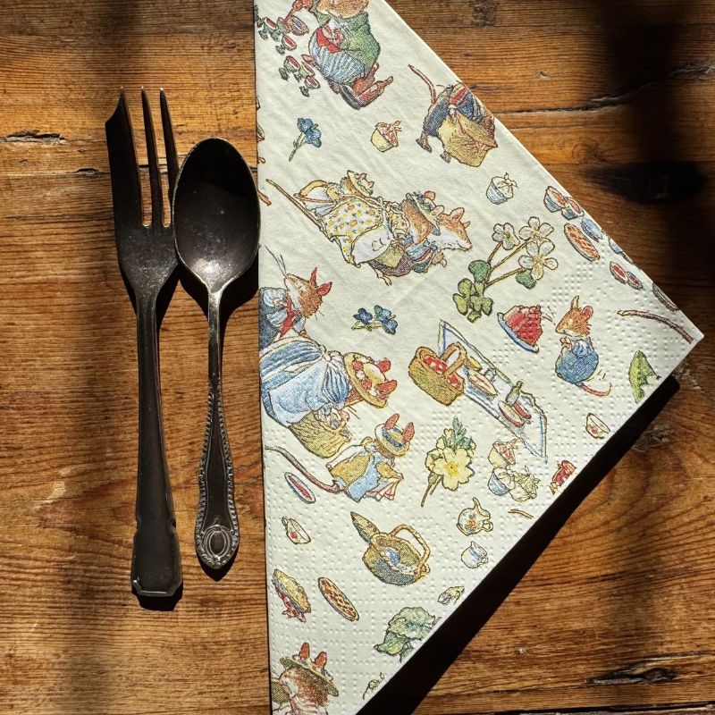 Pack of paper napkins with illustrations of characters from Brambly Hedge on a white background.