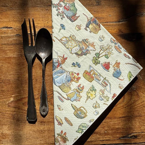 Museums & Galleries Brambly Hedge Paper Napkins next to cutlery on a wooden surface