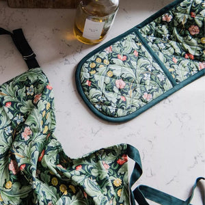 Museums & Galleries Leicester Wallpaper double oven glove and apron on a kitchen counter top.