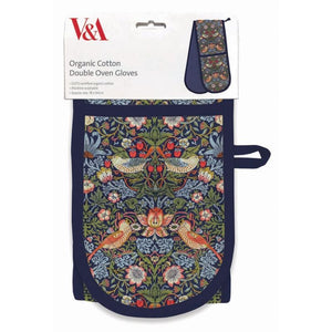 Pair of organic cotton double oven gloves with William Morris Strawberry Thief floral and bird pattern, V&A branding visible.