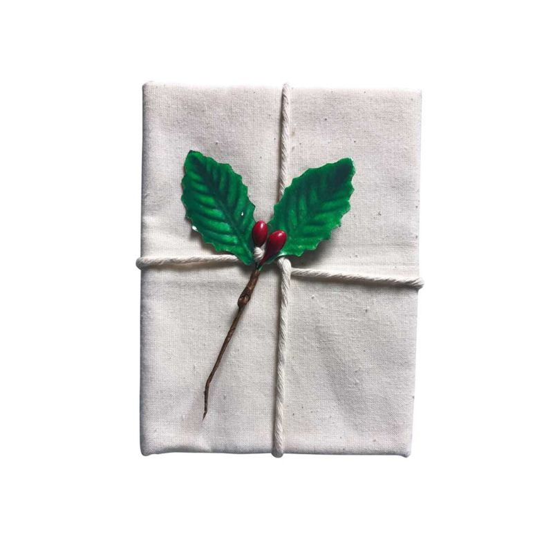 d.line Traditional Pudding Cloth with green holly leaves and red berries on a white background