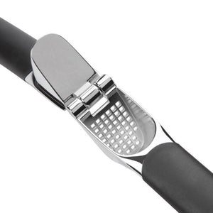 OXO Good Grips Garlic Press with black handle and silver metal head on a white background