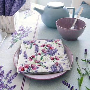 PAW Fragrant Lavender Paper Napkins styled next to a tea set on a blue table.