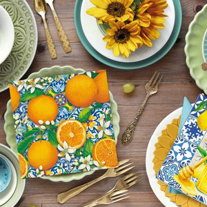 PAW Orange Bloom Paper Napkins styled with brass cutlery, sunflowers, and ceramic plates.