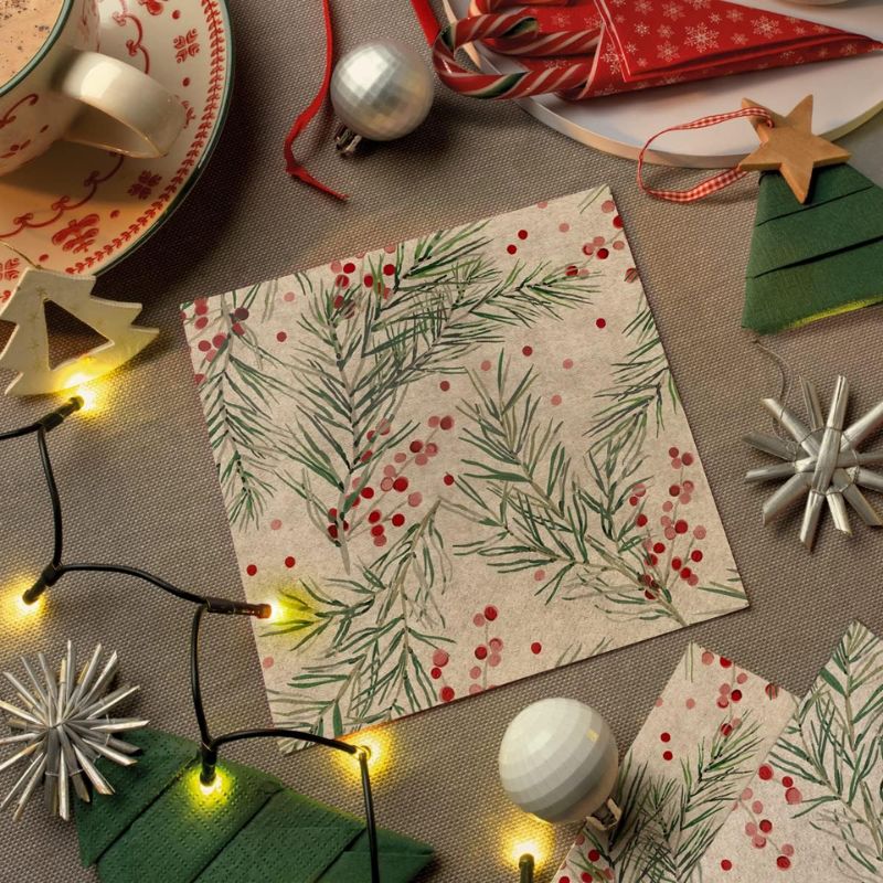 PAW Paper Napkins in the We Care Sprigs Holly design shown against a white background.