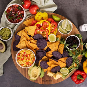 Peer Sorensen Lazy Susan serving board styled with corn chips, dips, and vegetables