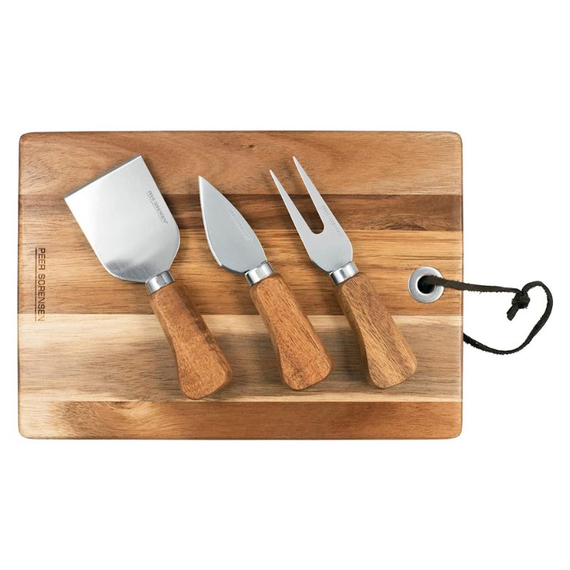 Peer Sorensen rectangular acacia cheese and serving board with three stainless steel cheese knives.