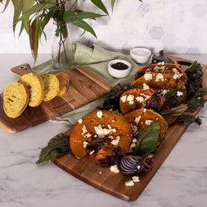 Peer Sorensen Tapas Serving Board with sliced bread, roasted pumpkin, onions, and feta.