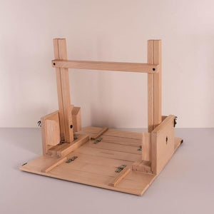 Picnic table base shown with handle frame in upright position, demonstrating convertible design