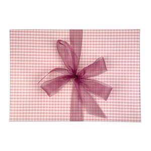 Pink gingham gift wrap with a purple ribbon