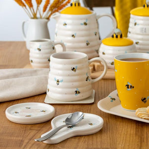 Price & Kensington Sweet Bee Spoon Rest styled with mugs and other ceramics in the Sweet Bee range.