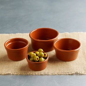Regas Spanish Terracotta Ramekins shown with the smallest size filled with olives.