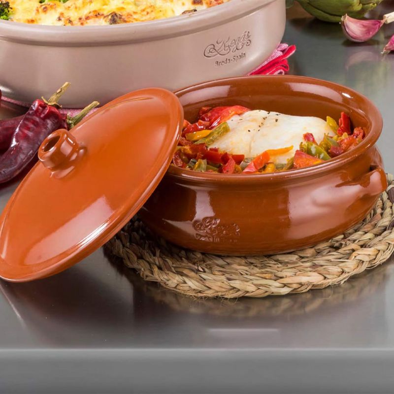 Regas Spanish Terracotta Round Casserole with Lid in table setting.