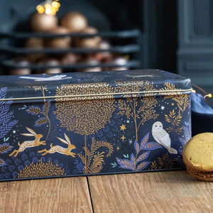 Side angle of Sara Miller Magical Nightfall rectangular tin showing owl, rabbit, and foliage motifs.