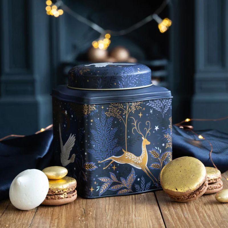 Lifestyle view of Magical Nightfall tea caddy on wooden bench with macarons.