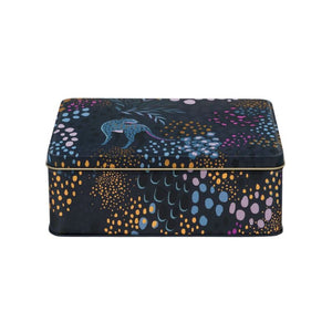 Sara Miller Midnight Leopard Biscuit Tin with a dark navy blue background and a vibrant, multicoloured abstract pattern featuring blue, yellow, pink, and purple dots and leaf-like shapes, shown on a plain white background.