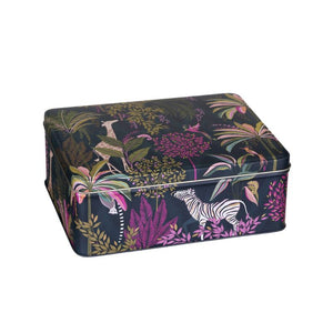 Sara Miller Palm Garden Biscuit Tin with a dark navy tropical jungle print featuring pink, green, and gold foliage, along with a white zebra on the front.