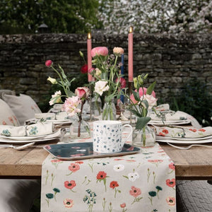 Sophie Allport Table Runner in the Poppy Meadow design in a rustic outdoor table setting - NZ