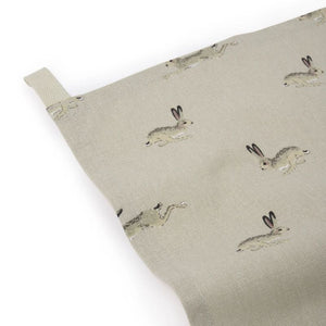 Close up of the Sophie Allport Hare Tea Towel - a cute bunny design on a warm neutral-coloured background.