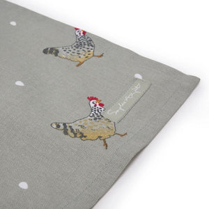 Corner of the Lay a Little Egg Tea Towel showing the Sophie Allport label.