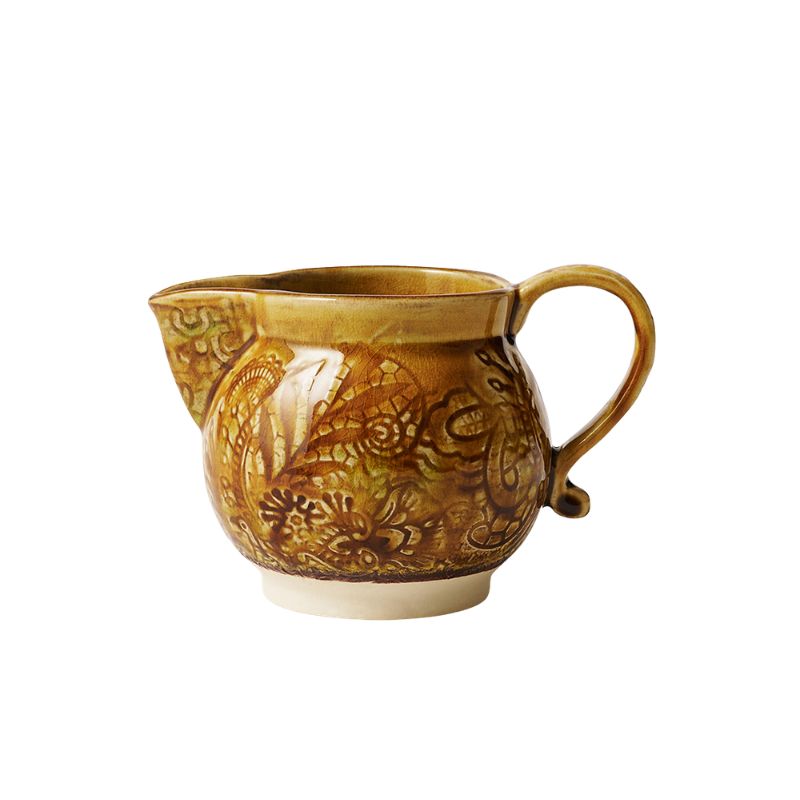 Sthal Arabesque Creamer in Pineapple colourway – a mustard yellow milk jug with intricate floral detail and a reactive glaze shown on a white background.