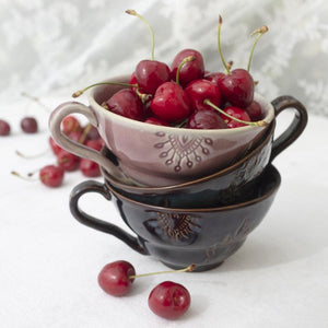 Stack of Sthal Arabesque Coffee Cups shown with fresh cherries.