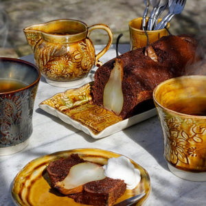 Sthal Arabesque ceramics in Pineapple colourway shown on a table setting.