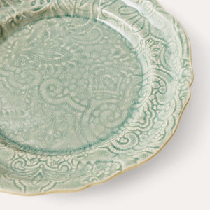 Close-up of Sthal Arabesque 23 cm Antique green ceramic plate highlighting reactive glaze and embossed detail.
