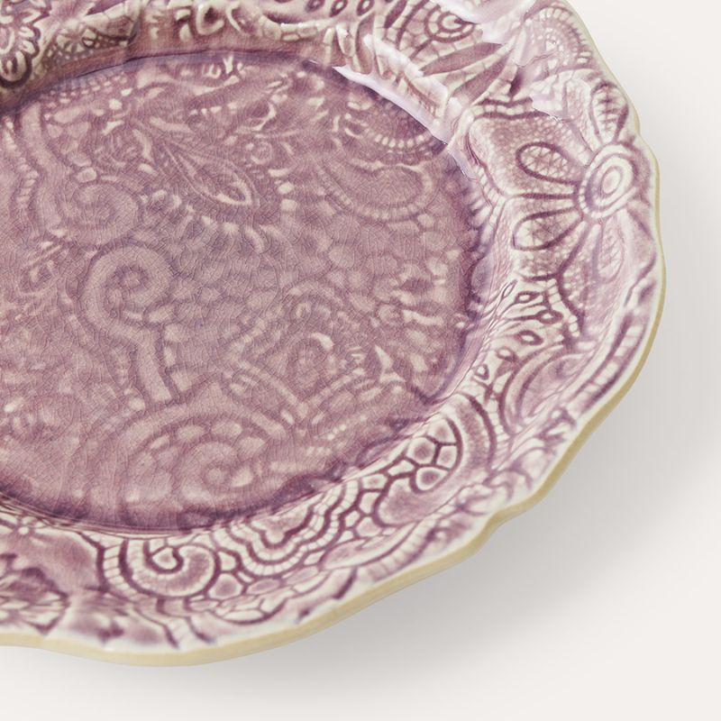Angled close-up of Sthal Arabesque Lavender plate highlighting crackle glaze and embossed design.