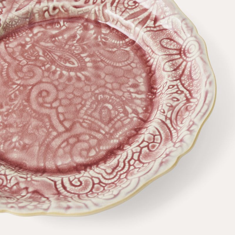 Angled close-up of Sthal Arabesque Old Rose plate highlighting crackle glaze and embossed design.